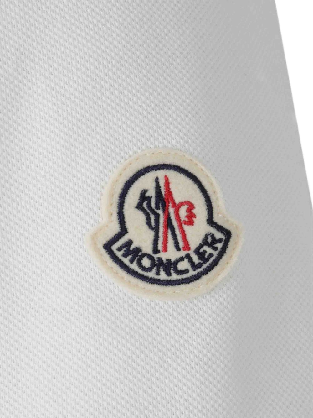 Polo con logo ricamato in bianco Moncler - uomo 