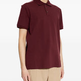 Polo con dettaglio a righe in piquet in rosso Moncler - uomo 