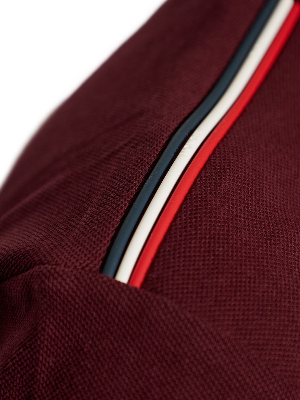 Polo con dettaglio a righe in piquet in rosso Moncler - uomo 