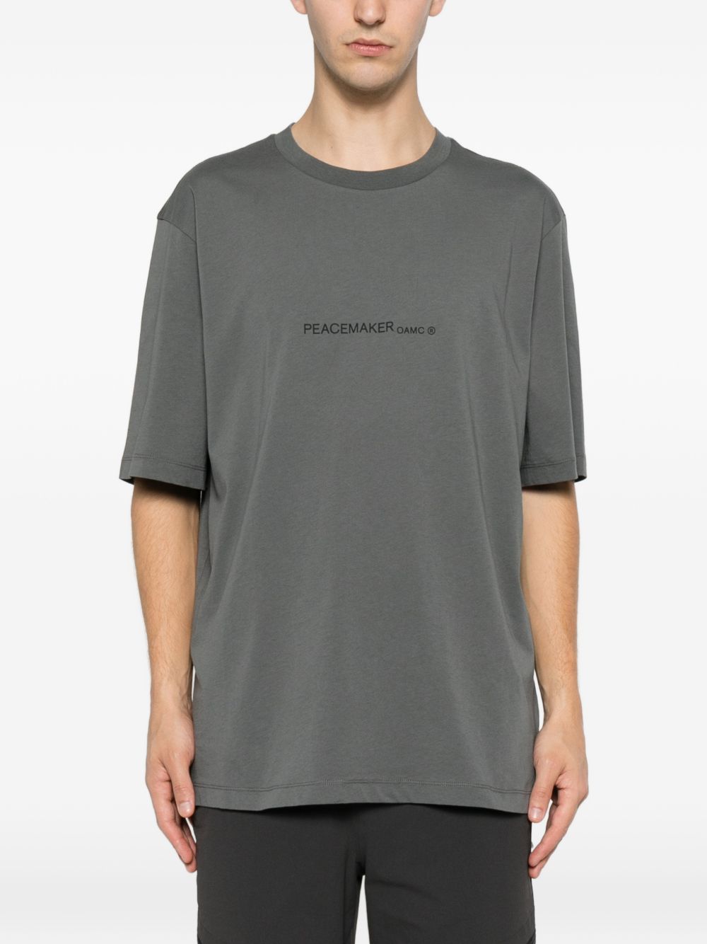 T-shirt con stampa grafica "Peacemaker" in grigio Oamc peacemaker - uomo 