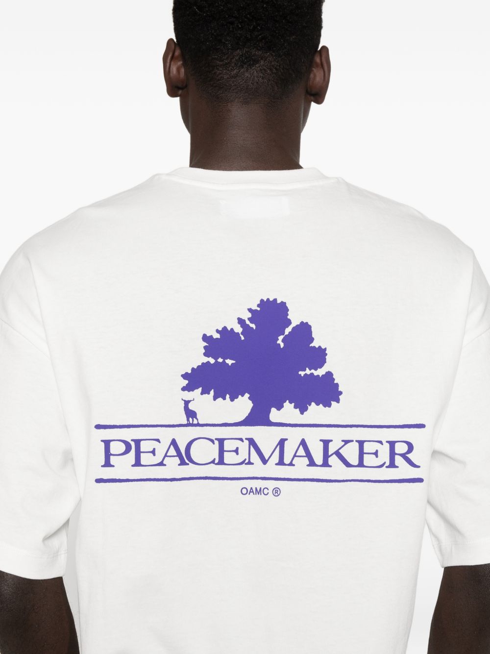 T-shirt con stampa del logo in bianco Oamc peacemaker - uomo 