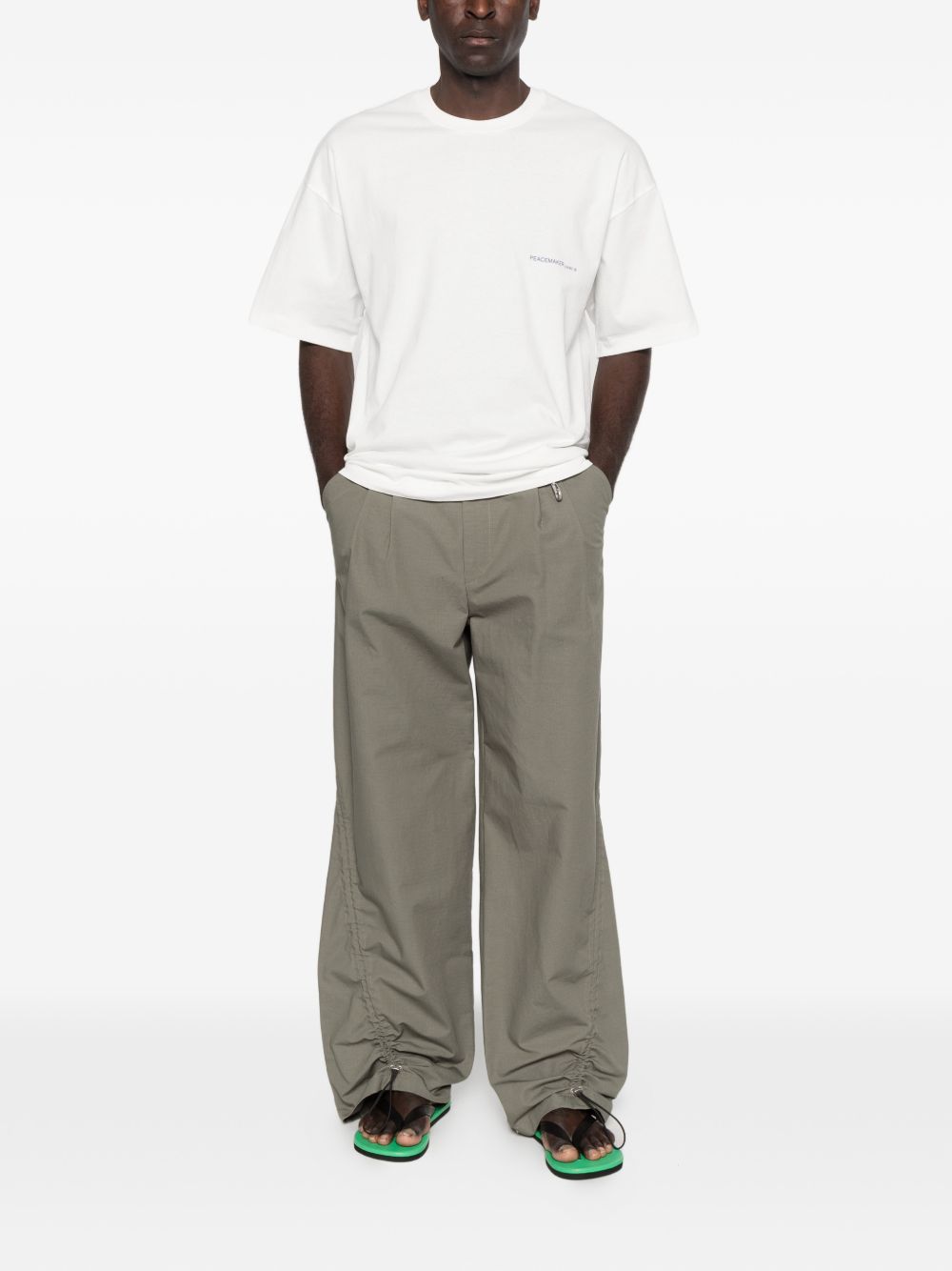 T-shirt con stampa del logo in bianco Oamc peacemaker - uomo 