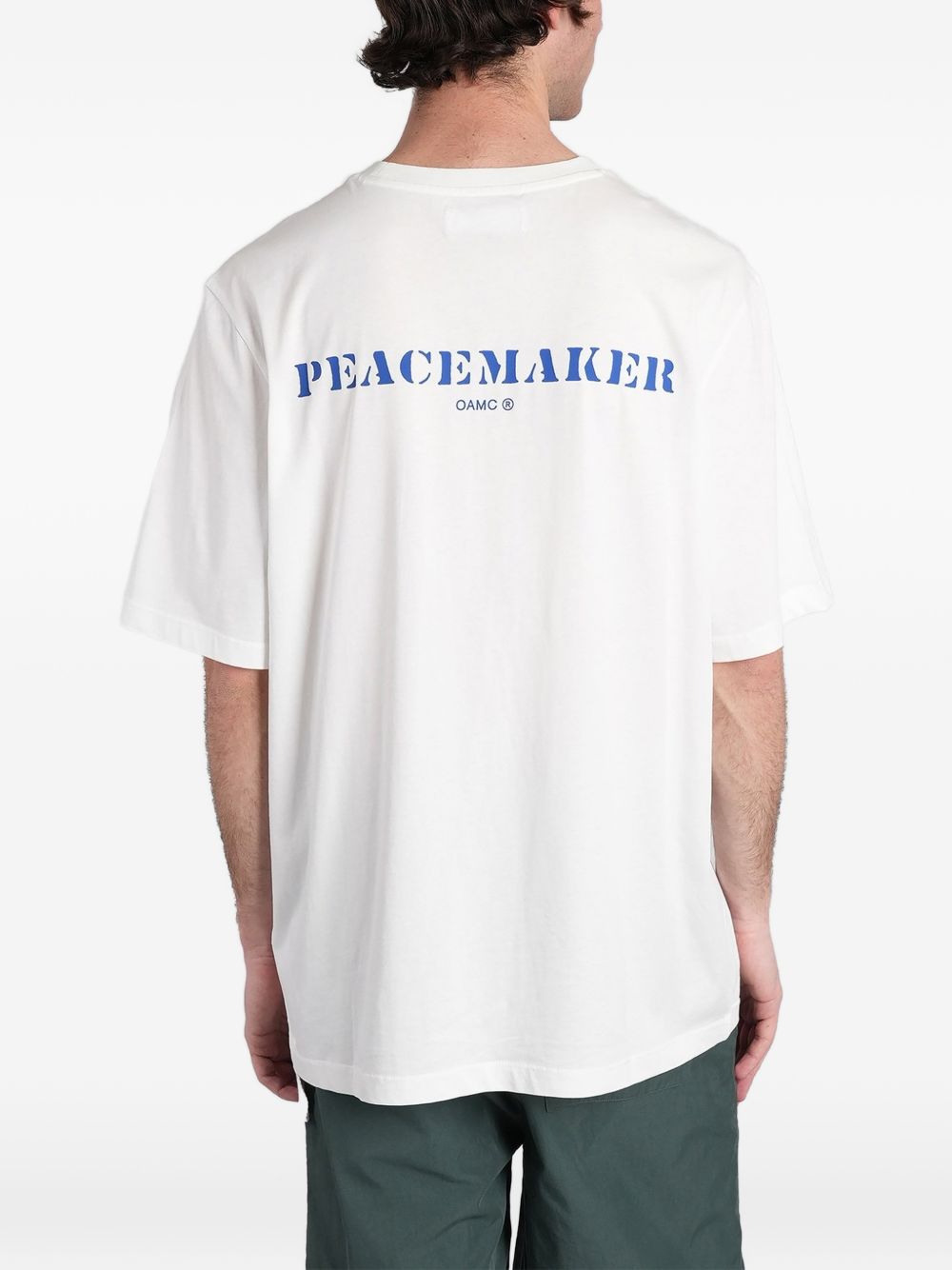 T-shirt con stampa del logo in bianco Oamc peacemaker - uomo 