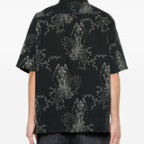 Camicia a maniche corte con fantasia in nero Our legacy - uomo 
