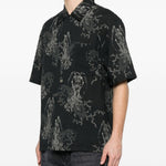 Camicia a maniche corte con fantasia in nero Our legacy - uomo 
