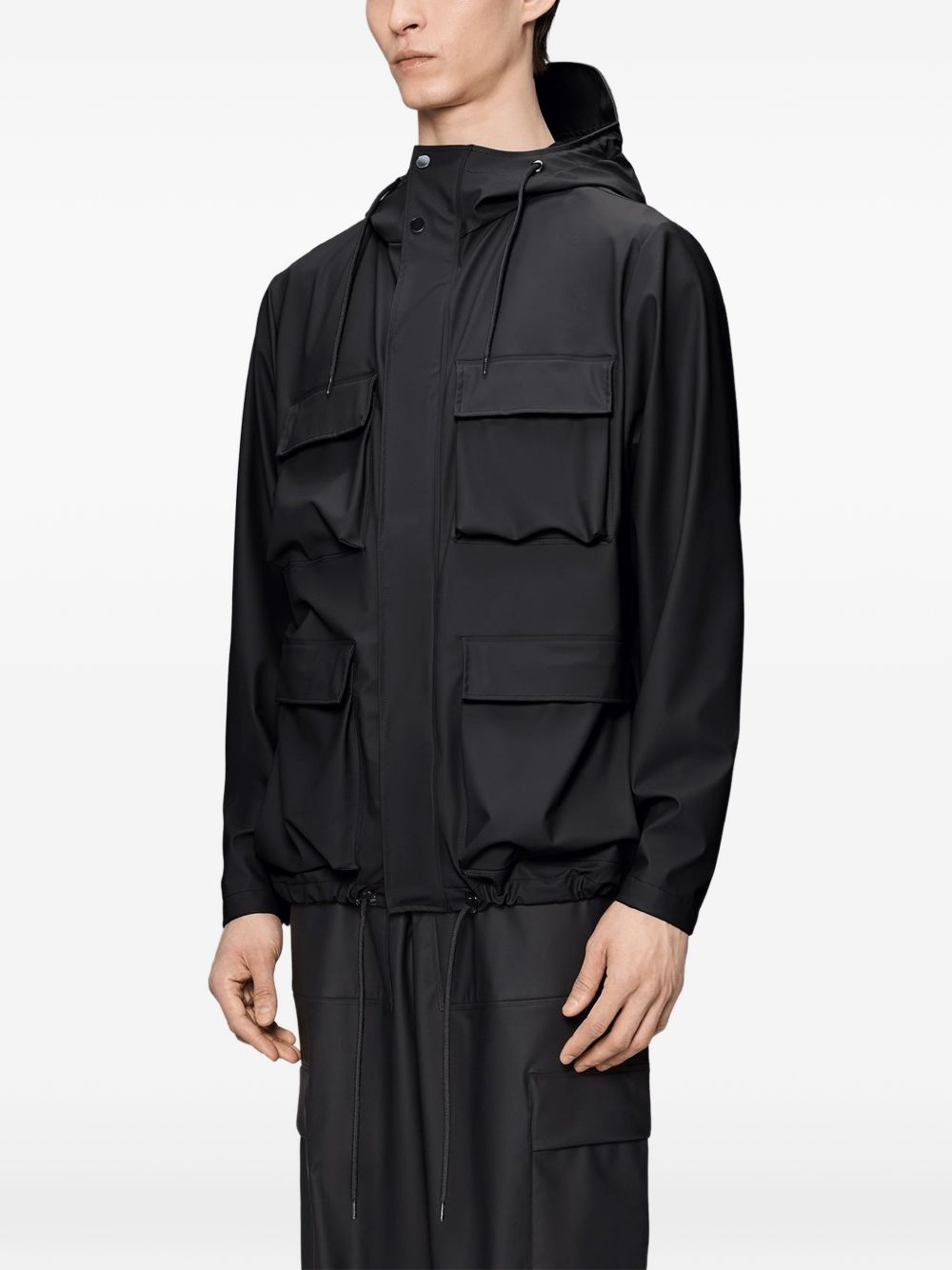 Giacca con cappuccio in nero Rains - unisex 