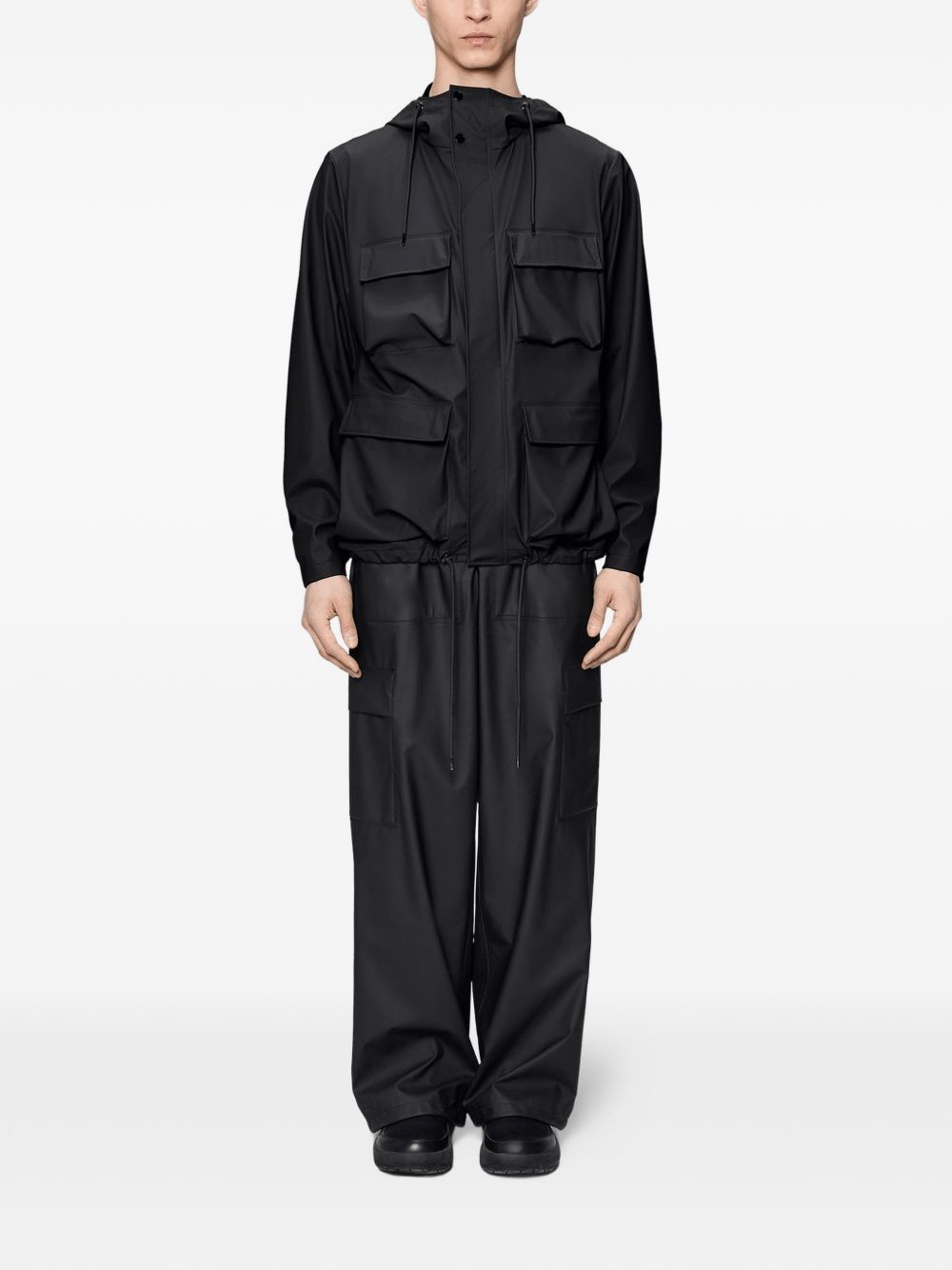 Giacca con cappuccio in nero Rains - unisex 