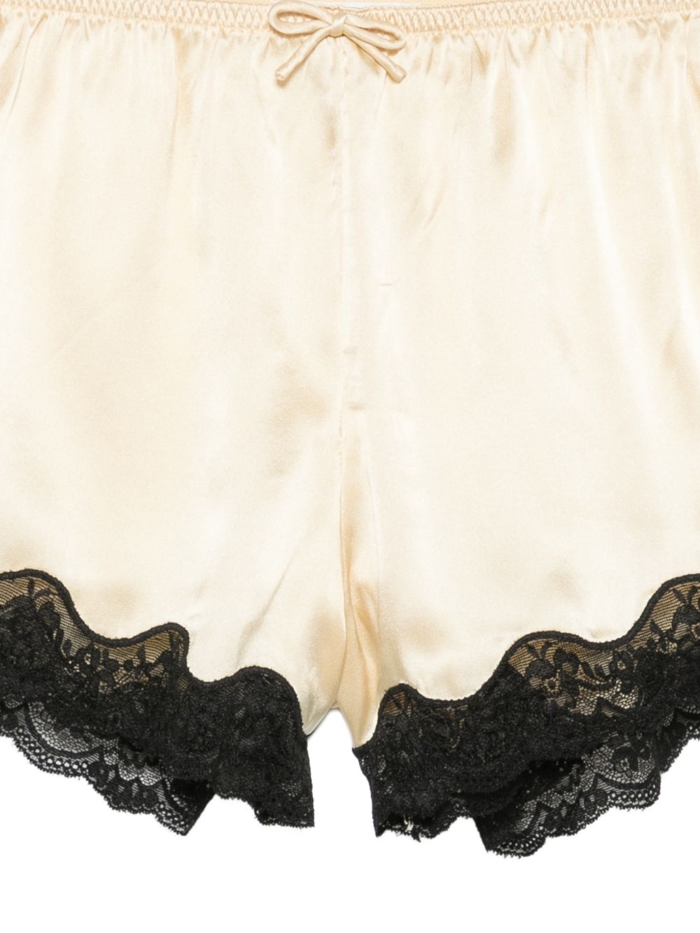 Pantaloncini con bordo in pizzo e fiocco decorativo in beige Rotate x love stories - donna 