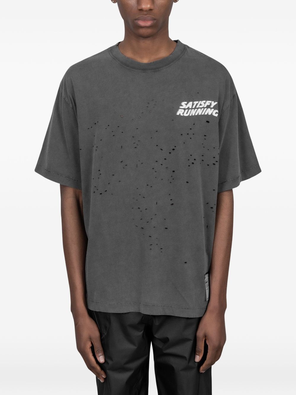 T-shirt con effetto vissuto in nero Satisfy - unisex 