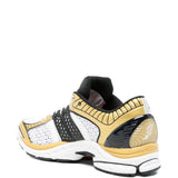 Sneakers Pro Grid Paramount in bianco e oro 