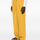 Pantaloni con coulisse in vita e piega stirata in giallo Second layer - uomo 