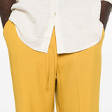 Pantaloni con coulisse in vita e piega stirata in giallo Second layer - uomo 
