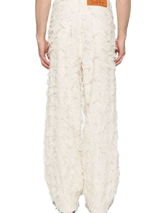 Jeans nikos con frange in bianco 