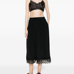 Pantaloni corti con orlo in pizzo in nero simone rocha - donna 