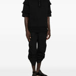 T-shirt con mezza zip e dettaglio a volant in nero Simone rocha - uomo 