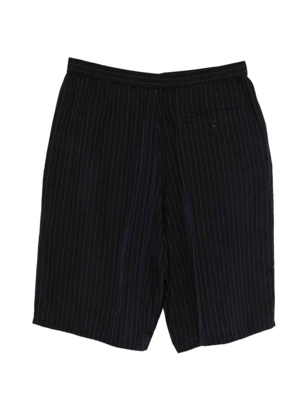 Shorts con fantasia gessata in nero Undercover - uomo 