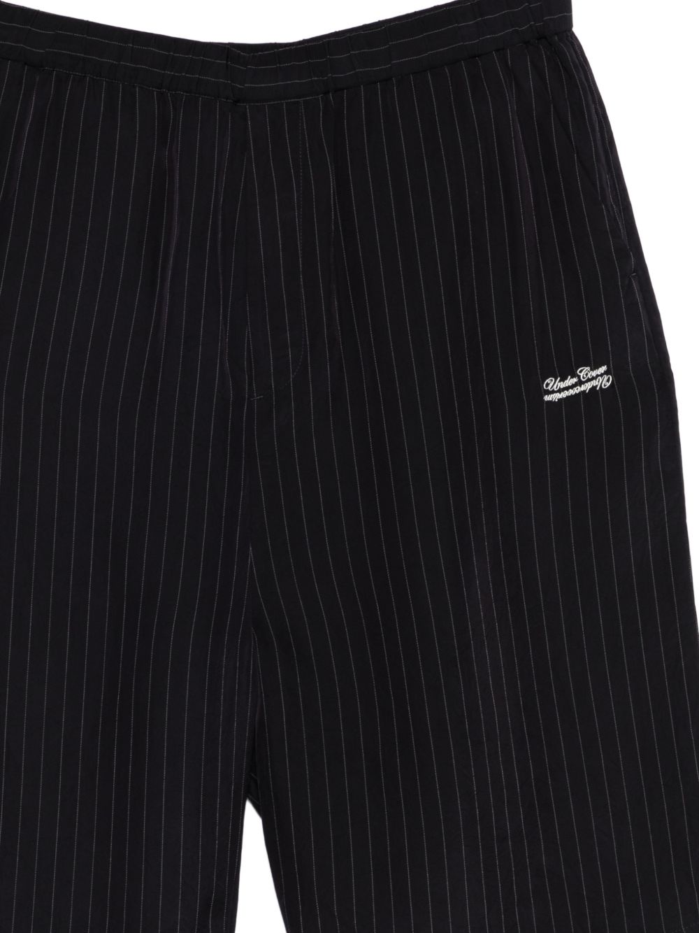 Shorts con fantasia gessata in nero Undercover - uomo 