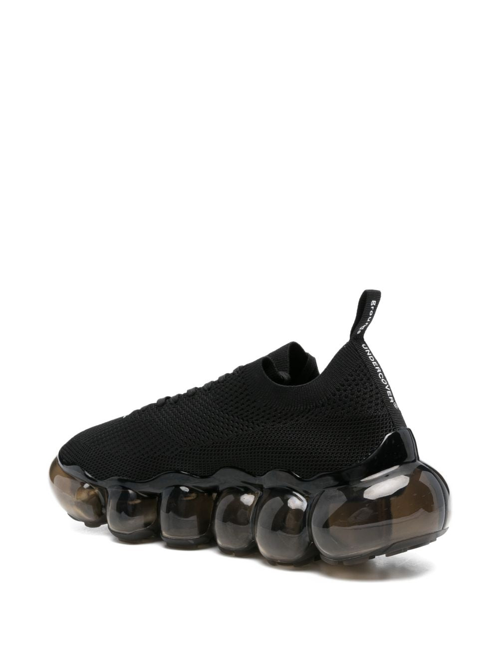 Sneakers con suola a bolle in nero Undercover - uomo 