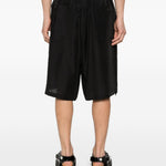 Shorts con orlo a coulisse in nero Yohji yamamoto - uomo 