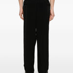 Pantaloni con pieghe frontali in nero Yohji yamamoto - uomo 