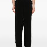 Pantaloni con pieghe frontali in nero Yohji yamamoto - uomo 