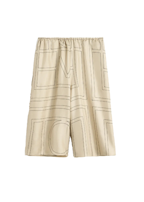 Shorts in seta con motivo monogram in beige 