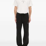 Pantaloni con applicazione in nero Mm6 maison margiela - uomo 