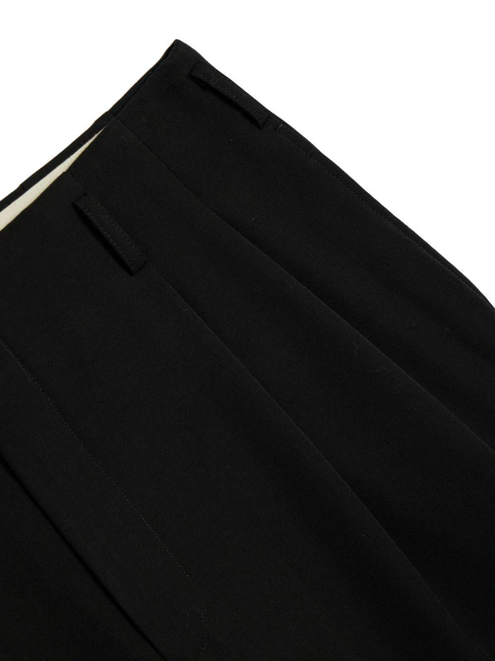 Pantaloni con pieghe in lana in nero Comme des garcons homme plus - uomo 