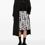 Shorts con stampa Fantasia in nero e bianco Comme des garcons black - unisex 