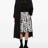 Shorts con stampa Fantasia in nero e bianco Comme des garcons black - unisex 