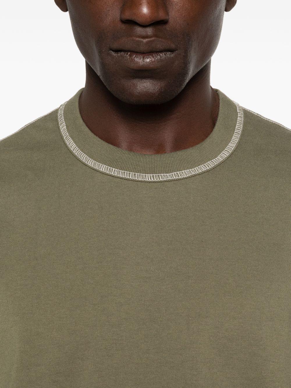 T-shirt con cuciture a contrasto in verde Comme des garcons homme - uomo 