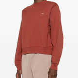 Felpa con logo a maniche lunghe in rosso mattone Adidas by stella mc  cartney - donna 
