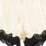Pantaloncini con bordo in pizzo e fiocco decorativo in beige Rotate x love stories - donna 