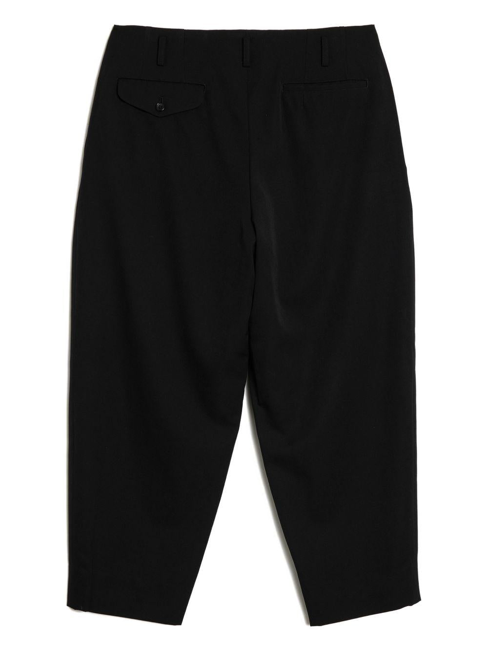 Pantaloni con pieghe in lana in nero Comme des garcons homme plus - uomo 