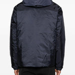 Piumino con cappuccio e logo in blu Moncler - uomo 