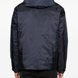 Piumino con cappuccio e logo in blu Moncler - uomo 