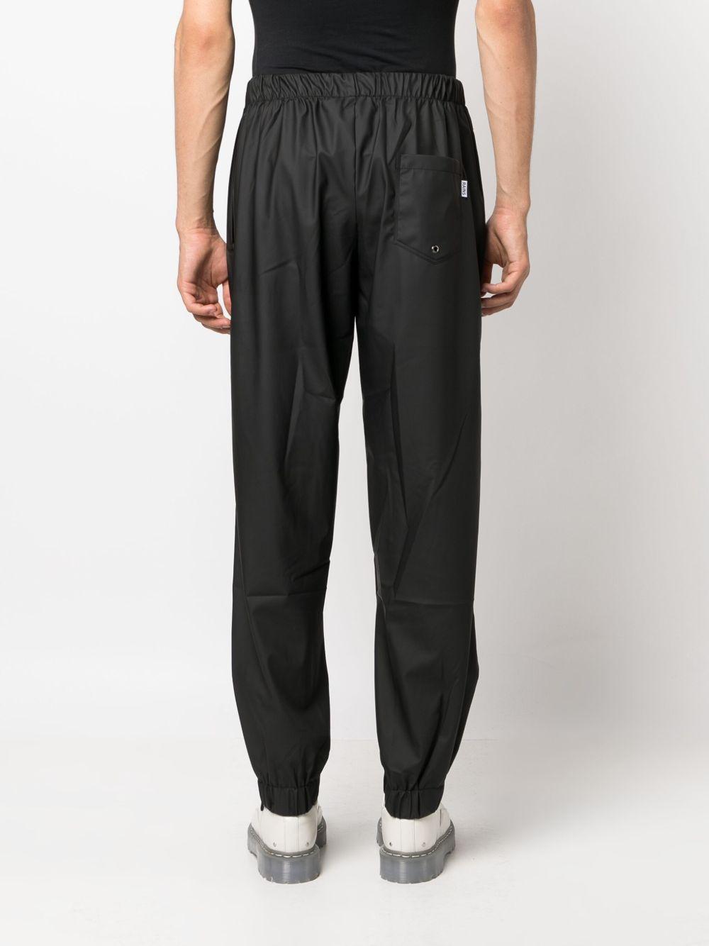 Pantaloni elasticizzati con coulisse in nero Rains - donna 