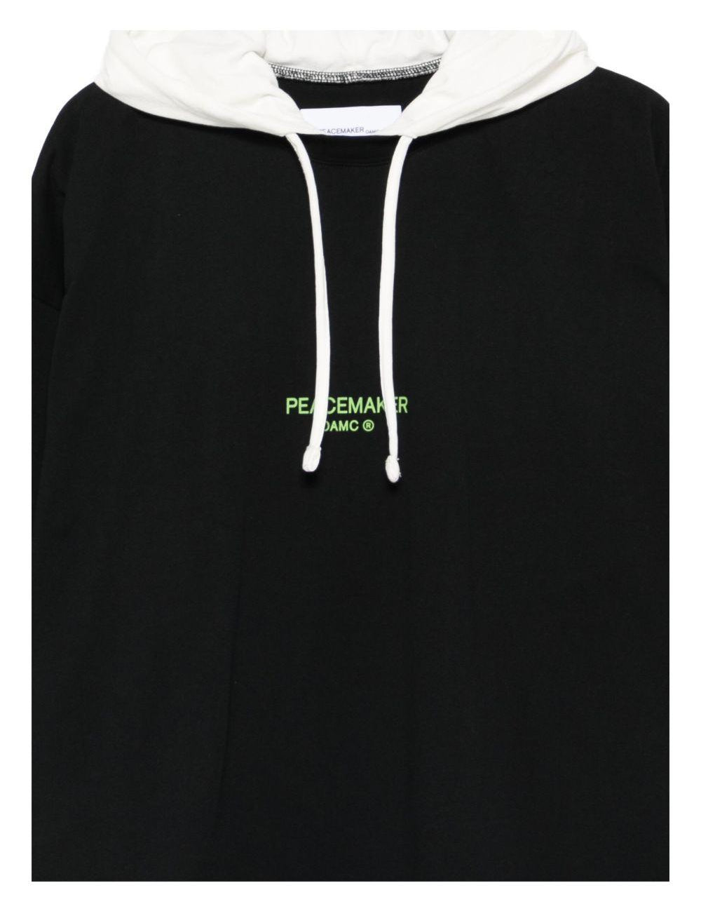 Felpa con cappuccio dynamo in nero e bianco Oamc peacemaker - uomo 