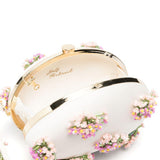 Clutch ovale con fiori in crema 