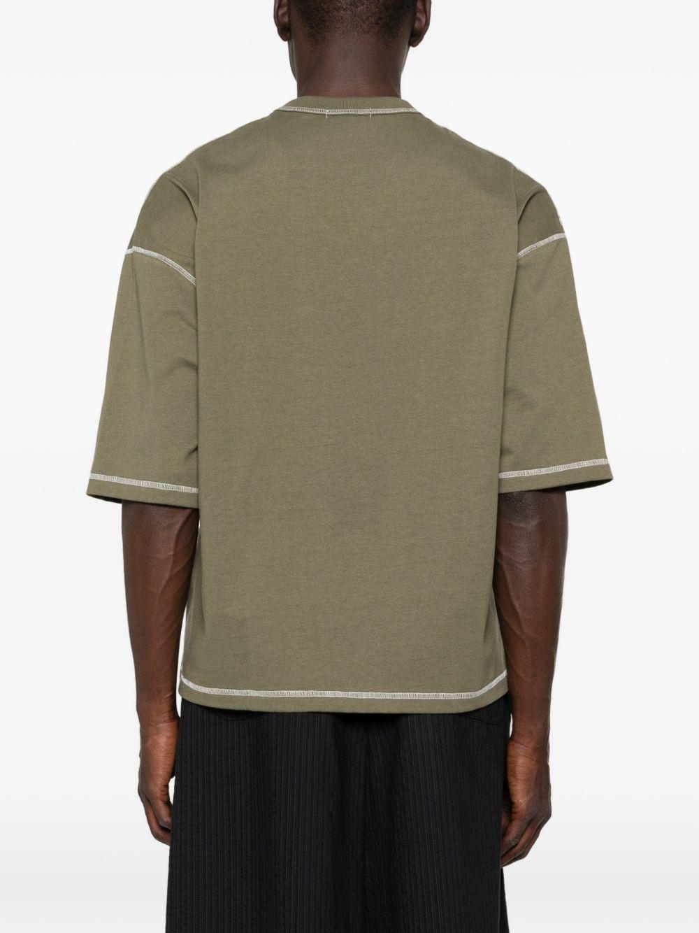 T-shirt con cuciture a contrasto in verde Comme des garcons homme - uomo 