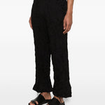 Pantaloni a gamba ampia in nero Gongdid design - uomo 