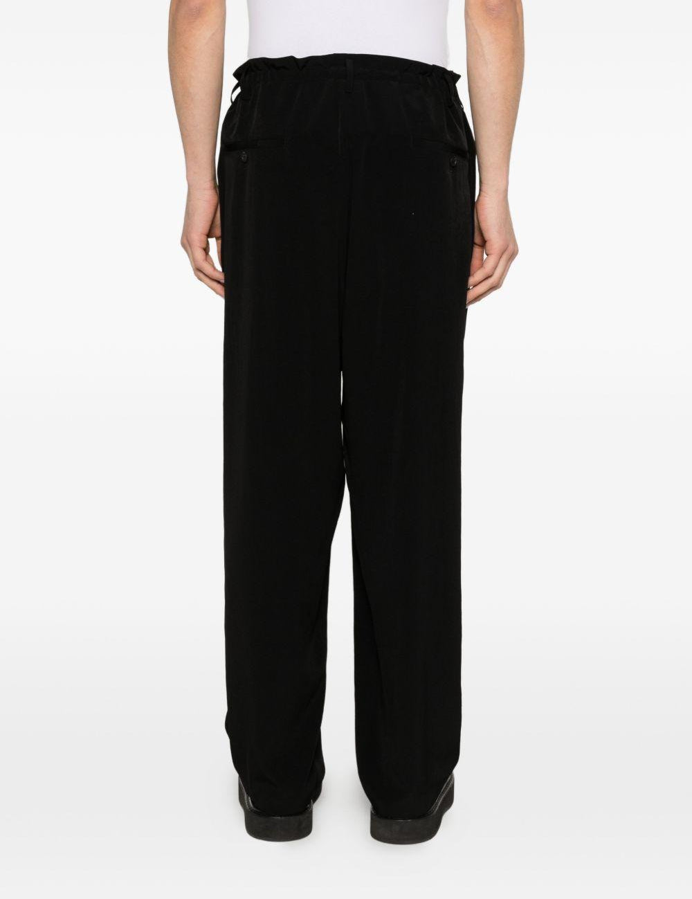Pantaloni con pieghe frontali in nero Yohji yamamoto - uomo 