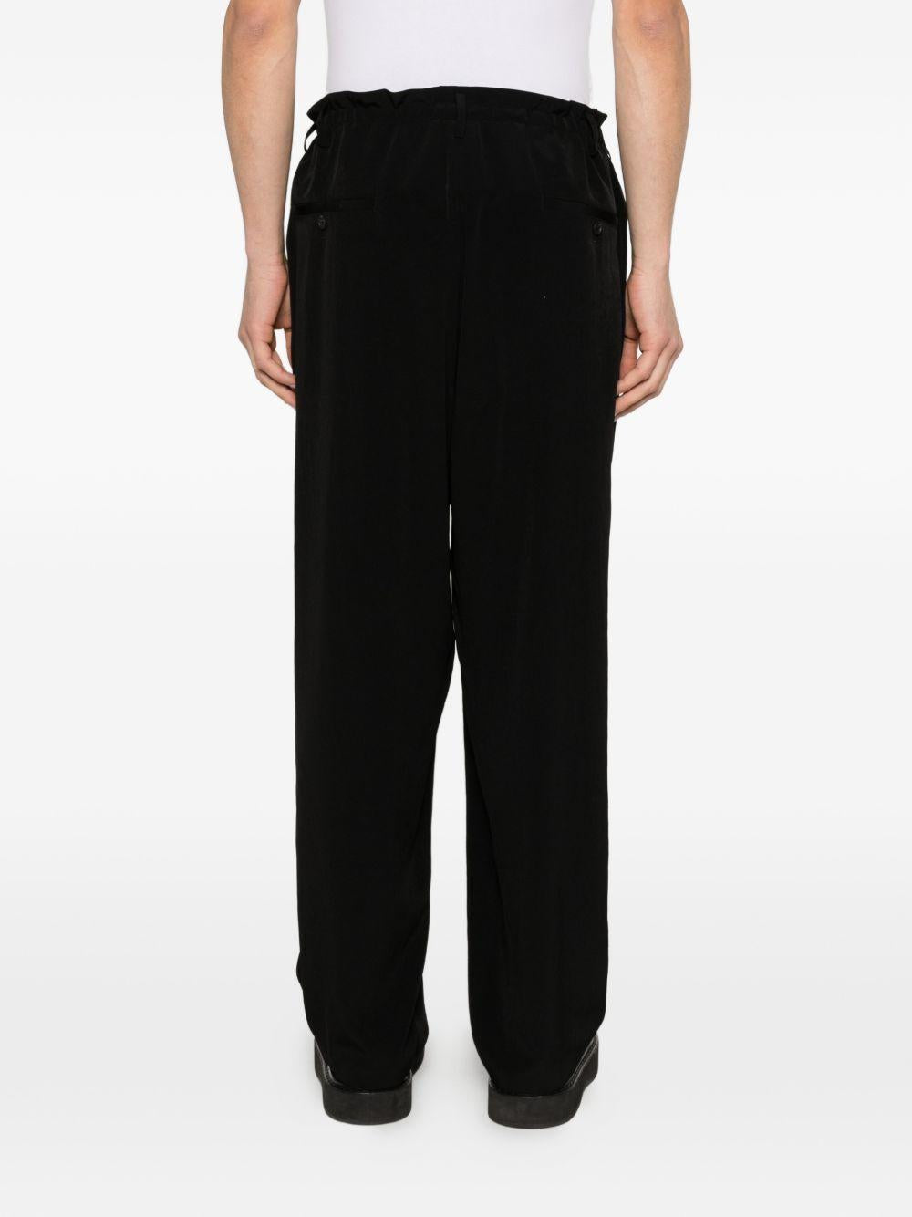 Pantaloni con pieghe frontali in nero Yohji yamamoto - uomo 