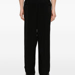 Pantaloni con pieghe frontali in nero Yohji yamamoto - uomo 