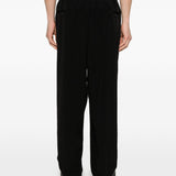 Pantaloni con pieghe frontali in nero Yohji yamamoto - uomo 