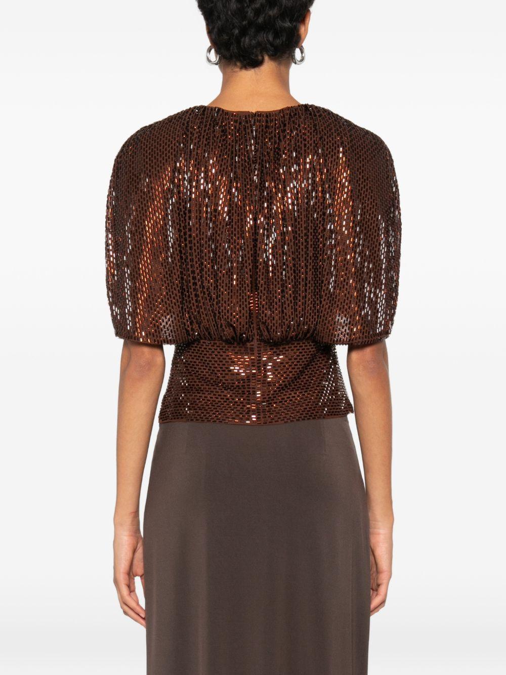 Top arricciato decorato con paillettes 