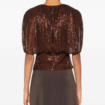 Top arricciato decorato con paillettes 