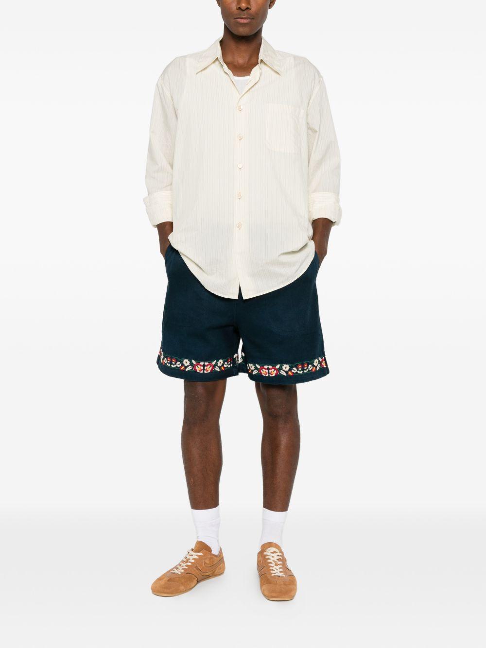 Shorts in twill con ricami floreali in blu Found - uomo 