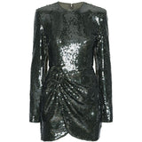 Abito corto con paillettes in verde 