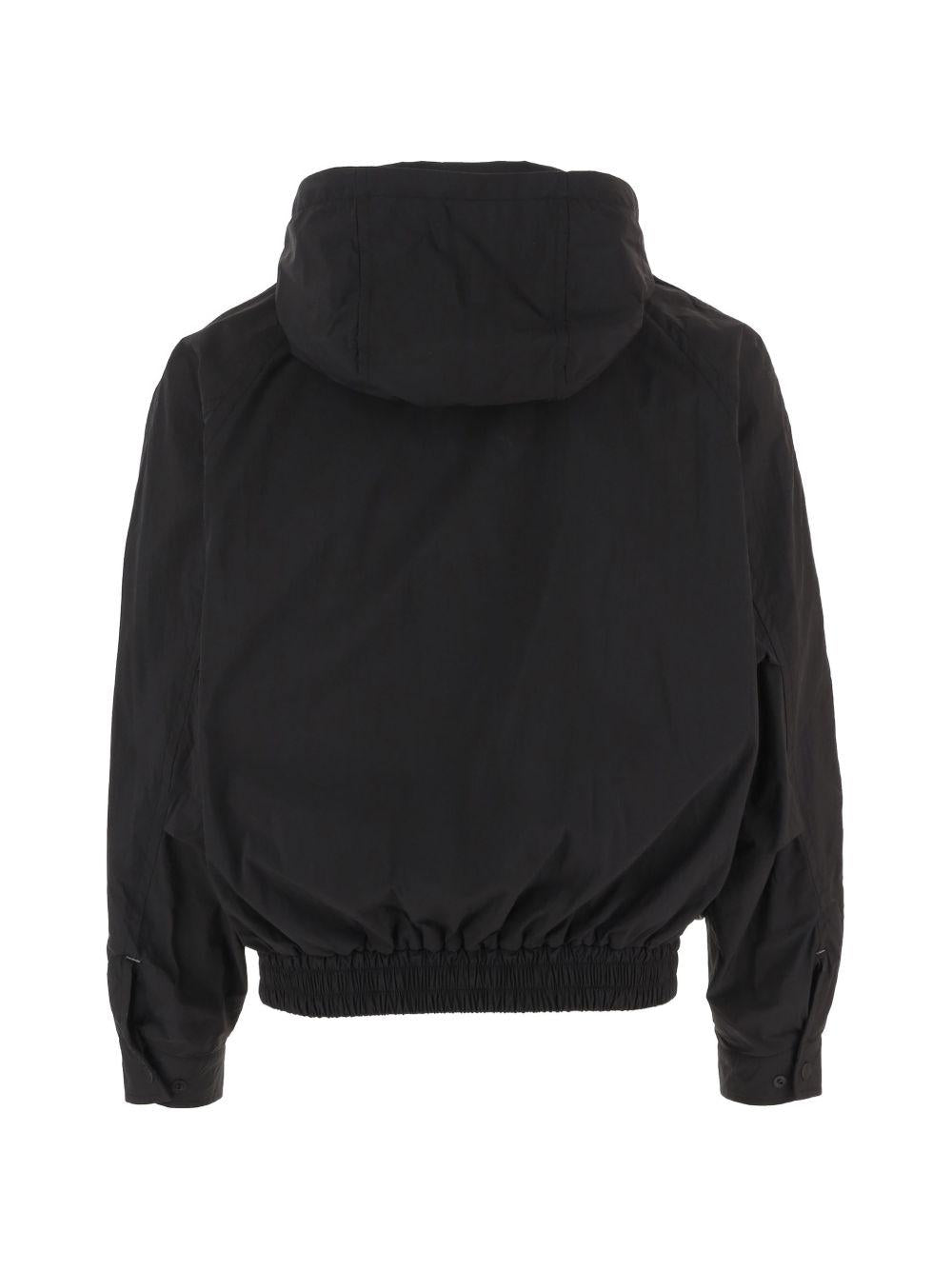 Giacca con cappuccio in nero And wander - uomo 